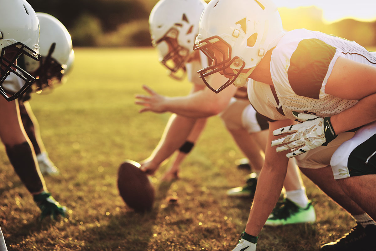 american football players in field